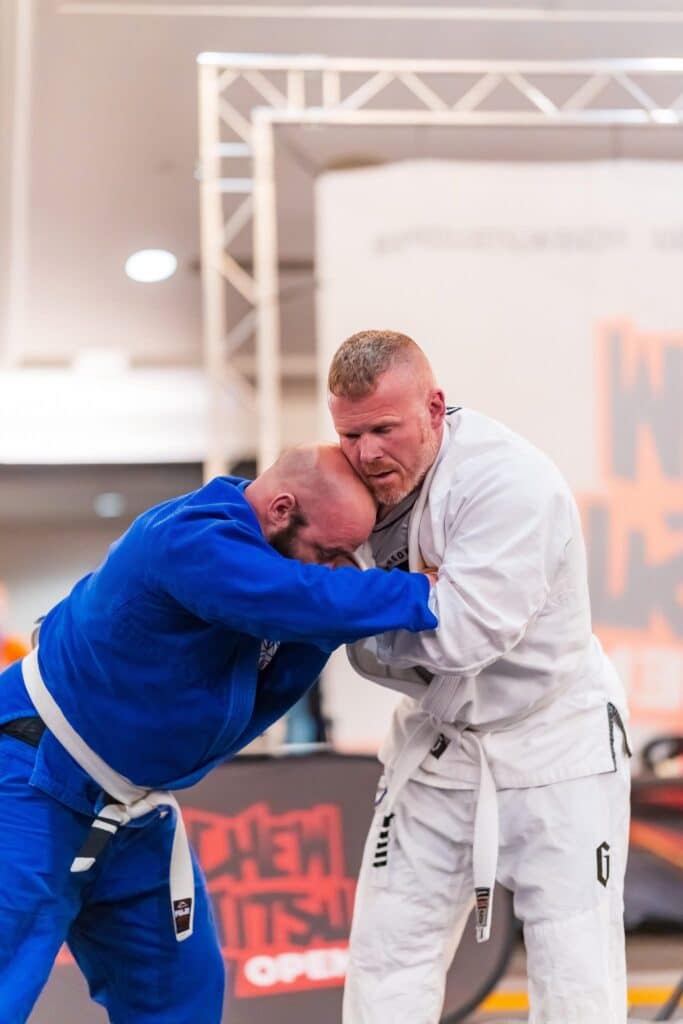 pinnacle jiu jitsu members in gi grappling, closeup