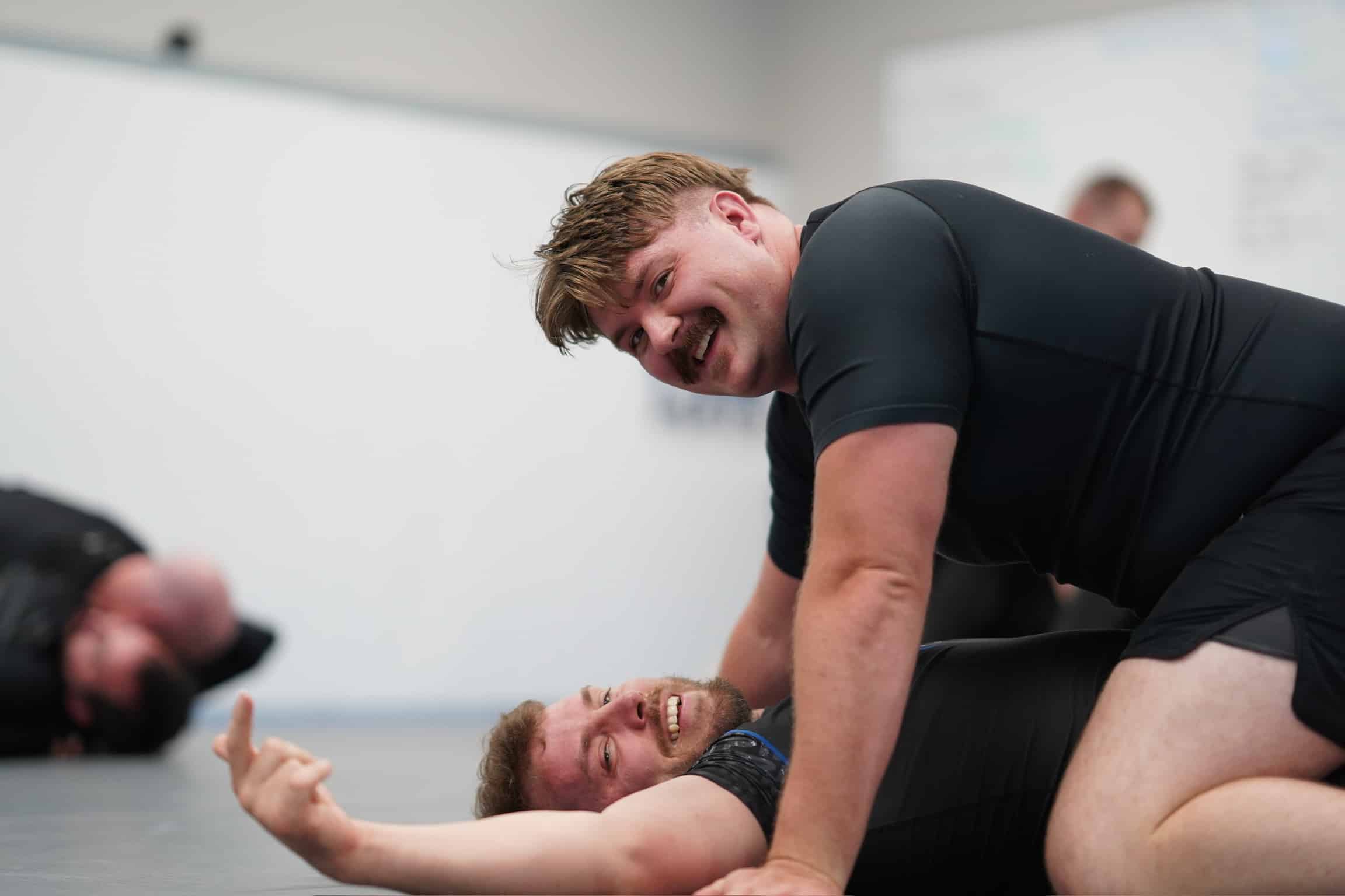 pinnacle jiu jitsu grappling close up smiling at camera